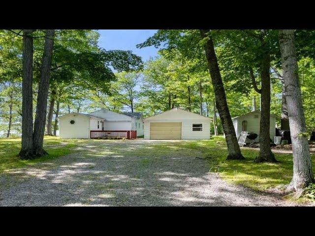 7426 PARADISE TRAIL, CARP LAKE, MI Presented by Lynn Robinson.