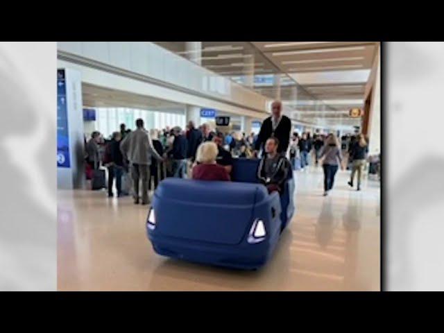 Golf carts to help passengers on long trek through Orlando airport's Terminal C