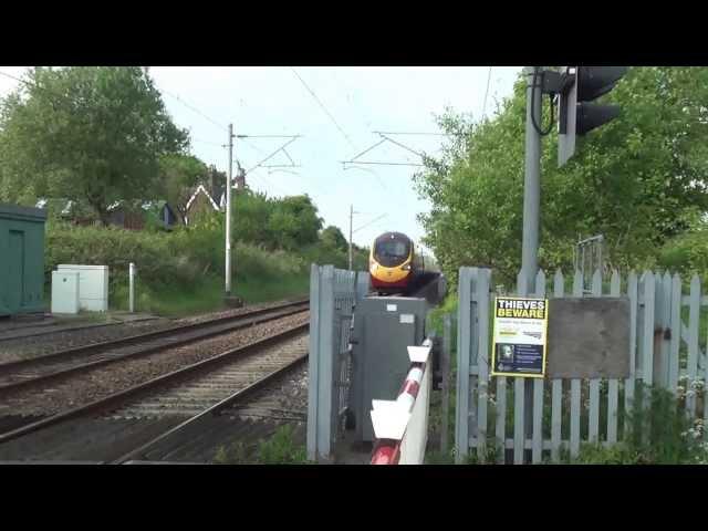 Pendolino at 125Mph Through Level Crossing