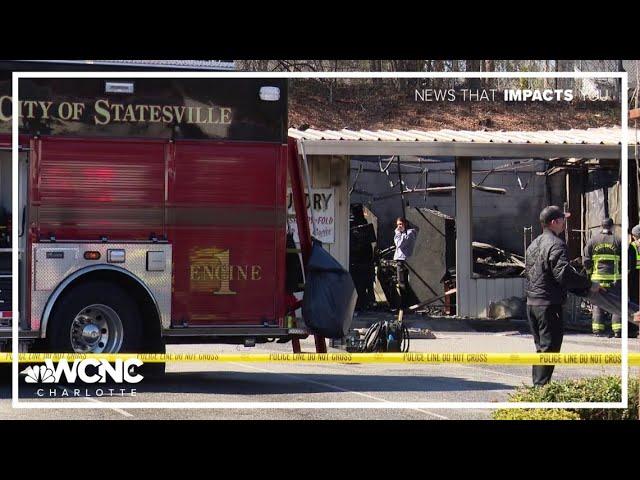 Person killed after car crashes into Statesville laundromat, causing fire