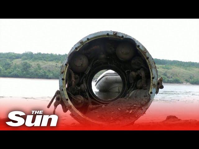 Old ship ruins and Soviet-era missiles emerge after dam's destruction