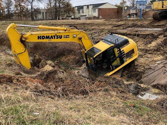 Stuck Trackhoe Excavator Busts Water Main! Worst Driver Ever!