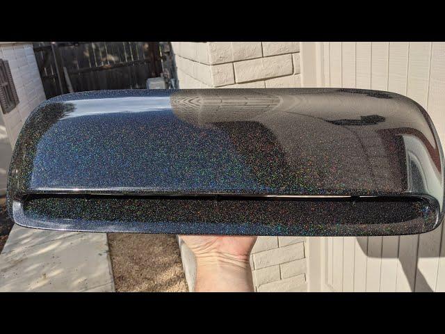 Subaru hood scoop wrapped in Oracal 970RA Black galactic gold vinyl wrap before and after.