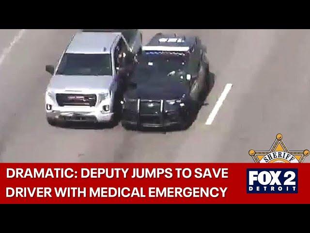 Video shows dramatic rescue on Gratiot with deputy jumping into truck