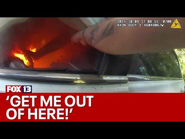 Bodycam video shows first responders pull man from burning car in WA