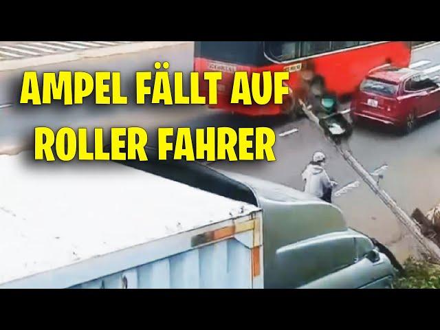 AMPEL FÄLLT AUF ROLLER FAHRER