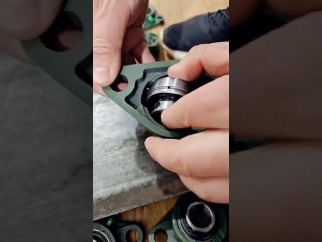 how to assemble insert bearing into bearing housing?