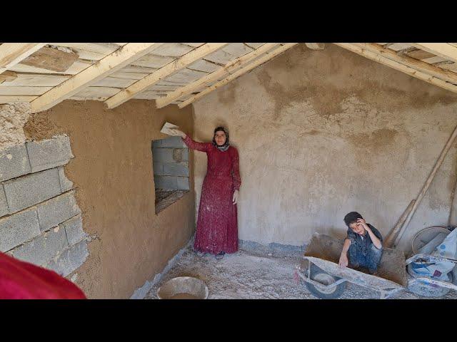 Completing the shelter with the capable hands of a nomadic mother