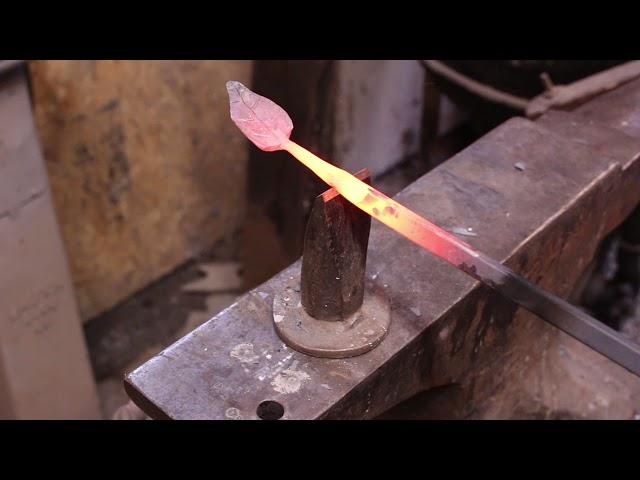 Forging a leaf from scrap steel