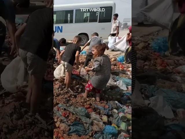 Children search garbage for food amid Israeli blockade in Gaza