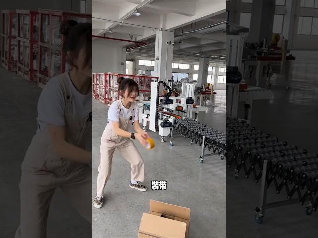 E-commerce strapping machine strapping use factory real shot carton sealing machine automation.