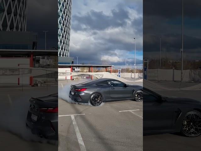 BMW M8 competition doing  burnout and donuts