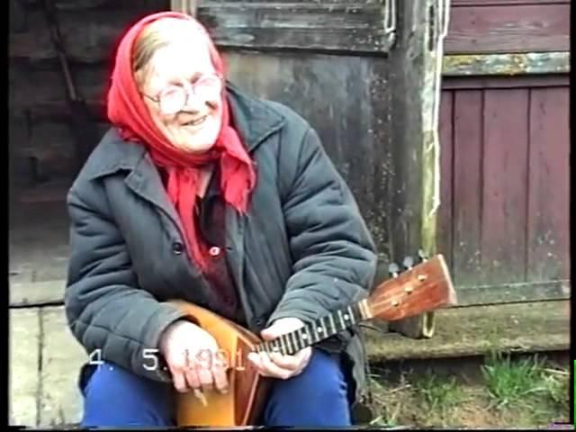 Old Woman Playing the Balalaika in Tver Region of Russia (1991)