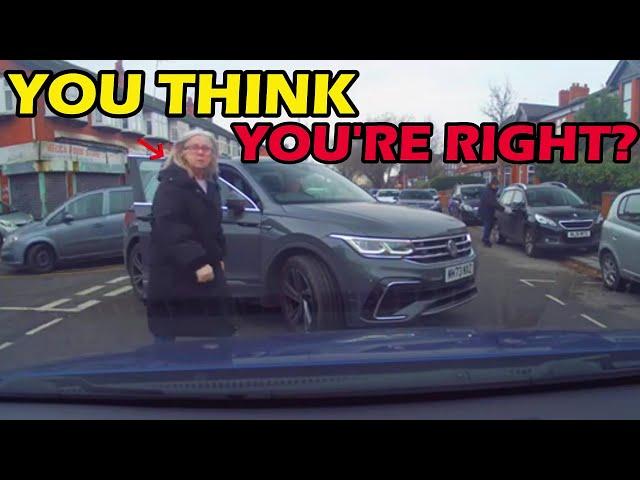 WOMAN JUMPS OUT TO SCOLD DRIVER AFTER BLOCKING HIM