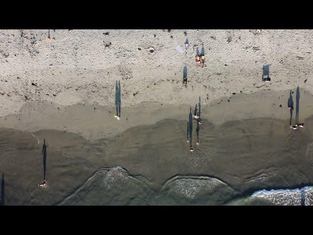 giant shadows on the sands of Ocean Beach in 4k