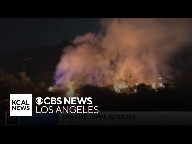 Car fire spreads to nearby brush off 405 Freeway offramp in Bel-Air