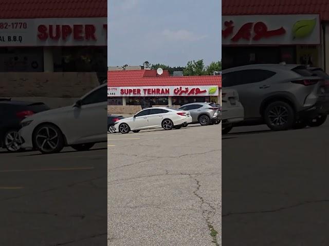 The flapping flags uncover the hidden supermarket that they promote: Super Tehran! #SuperTehran