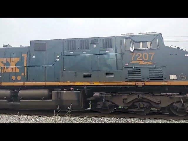 happy engineer blow his horn at family of railfans in Lowellville