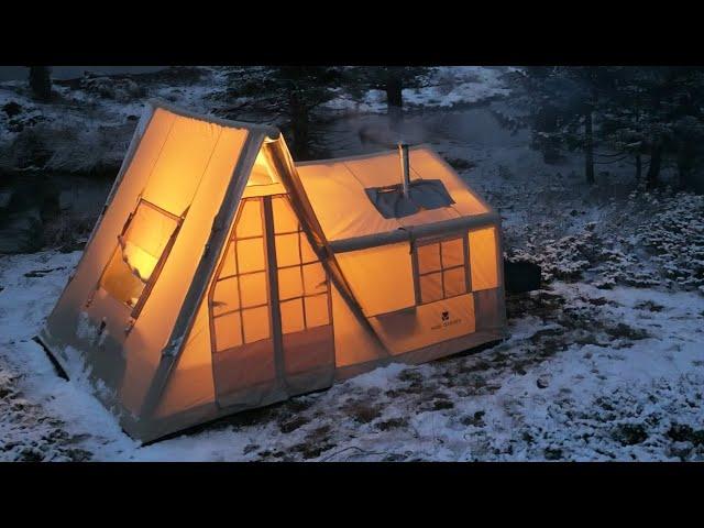 COZY TENT CAMP WITH STOVE IN A SNOWSTORM