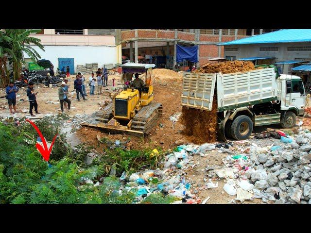 Starting New project Landfilling operator Bulldozer working push stone and Dump truck 5T unloading.