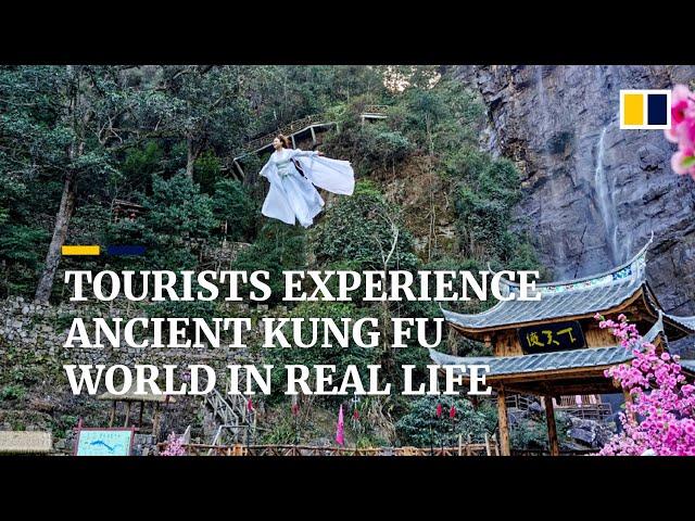 Dressed in costumes, tourists ‘fly’ into the sky to experience real life kung fu world