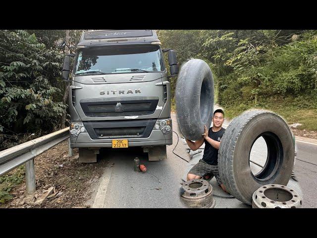 Rescue journey to repair a flat tire on a heavy-duty dump truck on a mountain pass