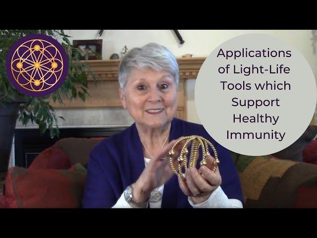 Supporting health using Light-Life Tools. Harmonizer, Lotus Pendant, Acu-Vac Coli, and Tensor Ring.