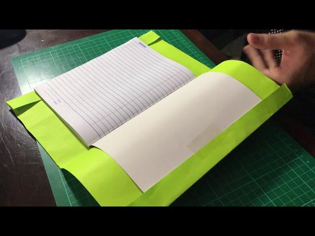 How to cover your notebook with a colored sheet of paper.