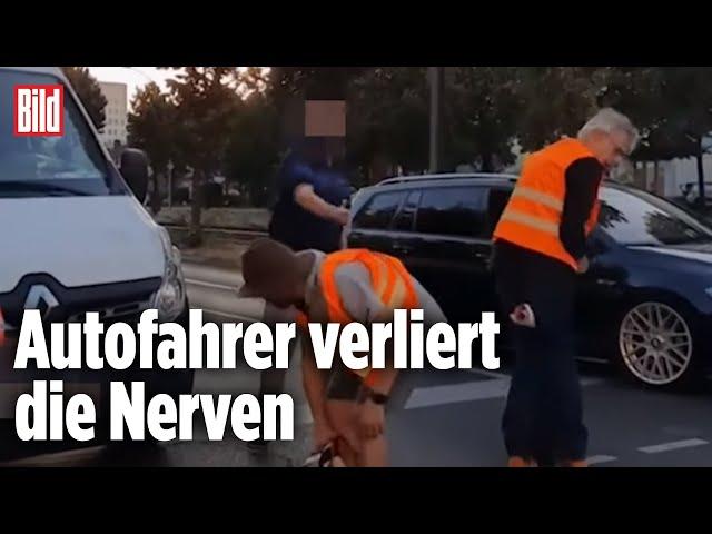 Wütender Autofahrer besprüht Klima-Kleber mit Reizgas | Berlin