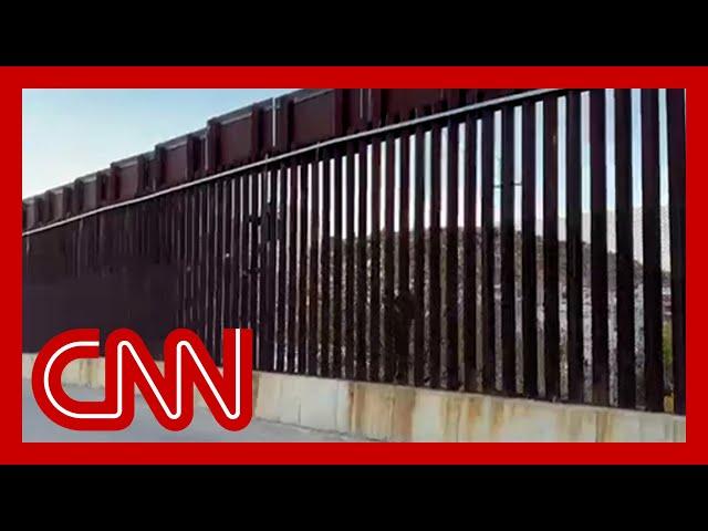 CNN cameras capture migrants attempting to scale southern border fence