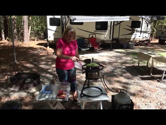 Getting philly cheese steaks ready using the outdoor cooker