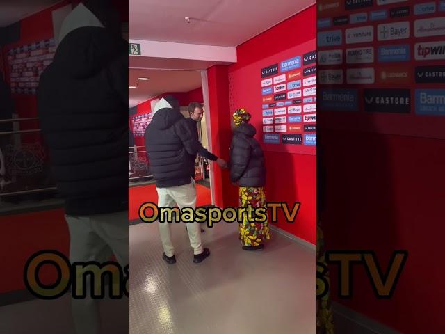 Boniface introduces his grandmother to Bayer Leverkusen teammates.