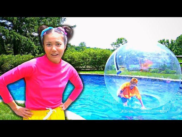 Ellie and Jimmy Play With Zorb Balls In The Swimming Pool!| Ellie Sparkles | WildBrain Learn at Home