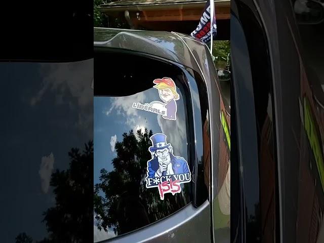 Political Statements: Stickers and Flags Supporting Controversial Figure