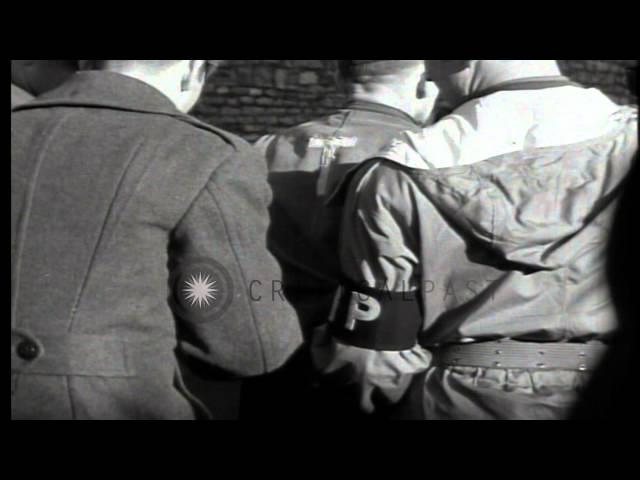 A Nazi war criminal approaches scaffold guarded by American MPs (Military Police)...HD Stock Footage