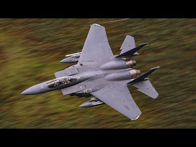 FIGHTER JETS SOARING THROUGH A RAIN-SOAKED MACH LOOP - 4K