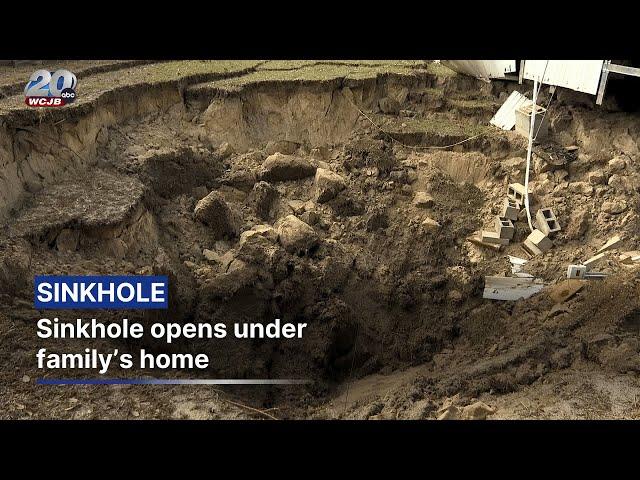 Sinkhole suddenly opens under family's home, damaging foundation