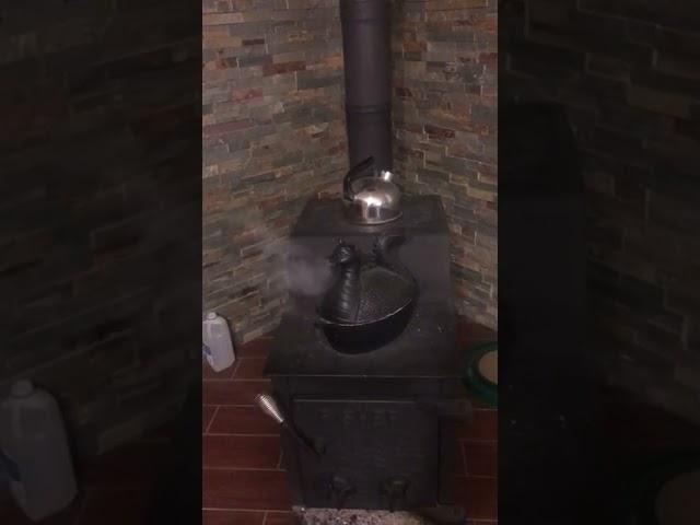 Cast Iron Dragon Steamer Pot on a Wood Stove