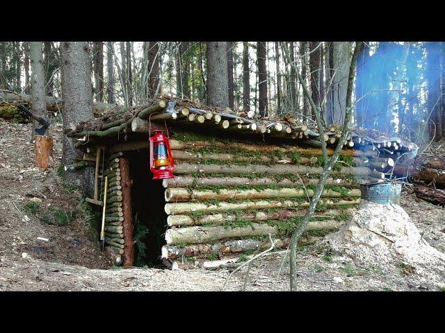 Construction of a warm shelter with a fireplace inside. Stayed overnight in a survival shelter