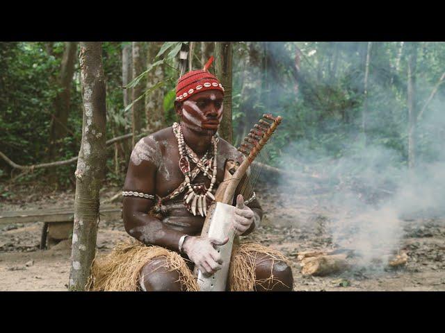 Bossengue Plays Harp and Sings the Sacred Music of Bwiti. Moughenda Village, Gabon