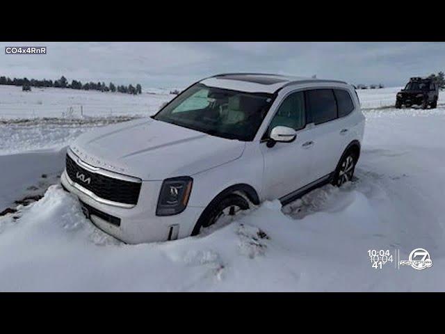 Volunteers work to dig out stranded cars in Elizabeth, Limon after historic snowstorm