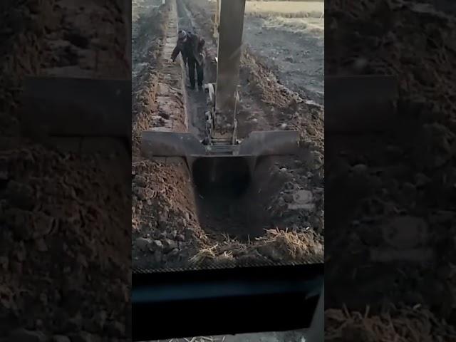 Creative bucket excavator making drainage ditch