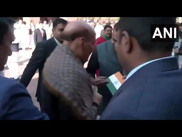 LoP Lok Sabha, Rahul Gandhi gives a Rose flower and Tiranga to Defence Minister Rajnath Singh