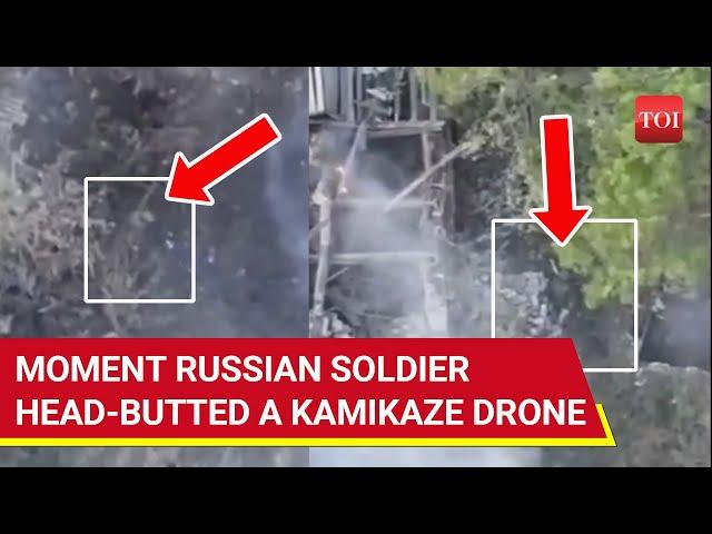 Russian Soldier Head-butts Ukrainian Kamikaze Drone, Then Emerges Like 'Zombie' From Smoke | Watch