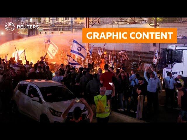 WARNING: GRAPHIC CONTENT - Israel: Cars drive through crowd of protesters in Tel Aviv