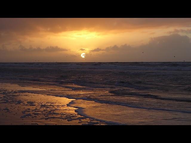 Sunset at stormy sea