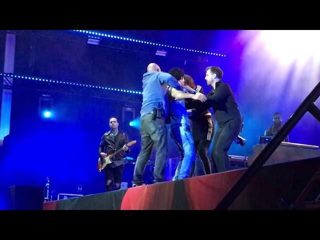 Fan sneaks on stage to hug Lana Del Rey during "ride" at flow festival in Helsinki, Finland