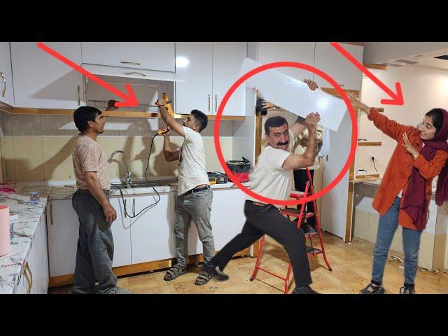 Hamdali, Setareh and Mehdi with the master cabinet maker on a construction project