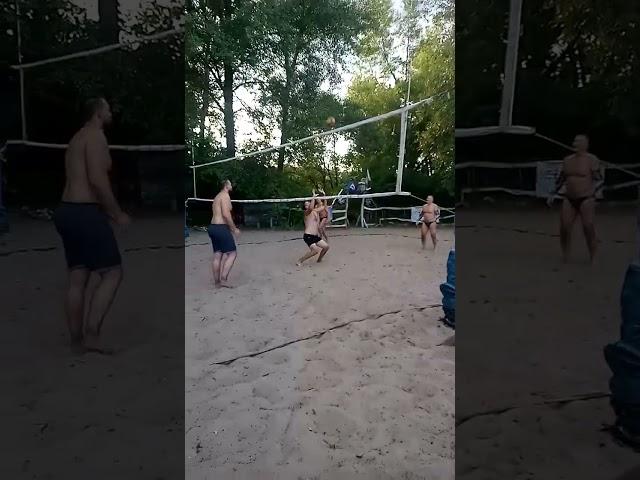 Beach volleyball, a strong pass of the ball to a distant player.