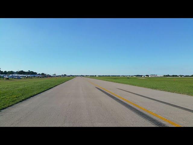 In the back of a VW, ride along the vintage flight lines at Oshkosh